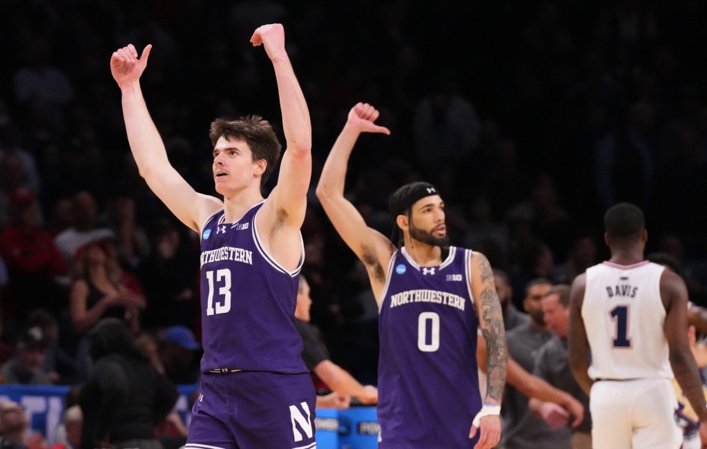 March 22, 2024, Brooklyn, NY, USA; Northwestern Wildcats guard Brooks Barnhizer (13) and Northwestern Wildcats guard Boo Buie (0) react in overtime against the Florida Atlantic Owls in the first round of the 2024 NCAA Tournament at the Barclays Center.