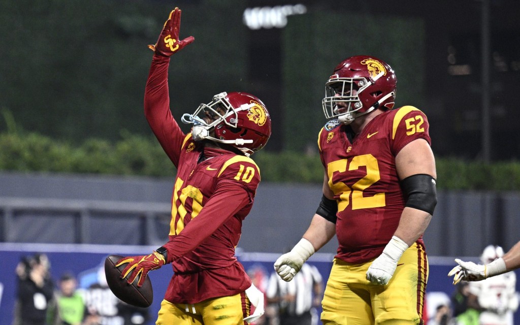 Dec 27, 2023; San Diego, CA, USA; USC Trojans wide receiver Kyron Hudson (10) celebrates after scoring a touchdown against the Louisville Cardinals during the first half at Petco Park.