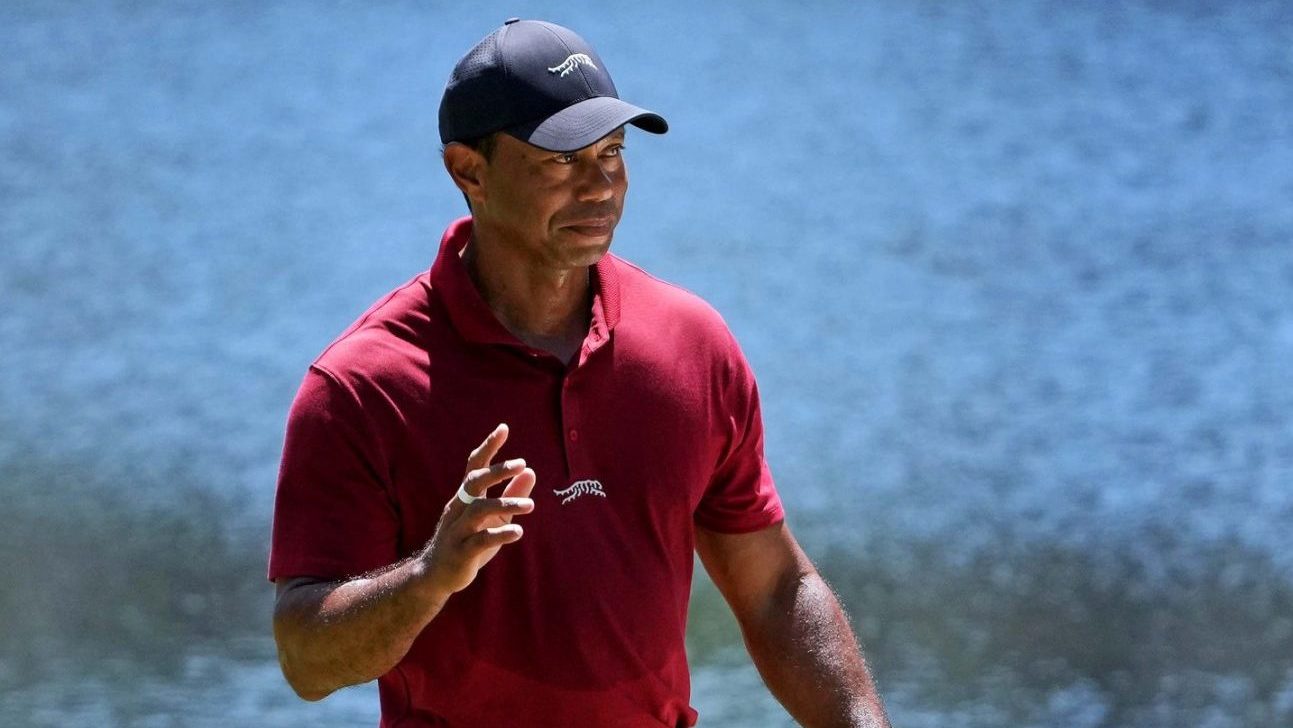 Apr 14, 2024; Augusta, Georgia, USA; Tiger Woods reacts to his putt on the 16th green during the final round of the Masters Tournament.