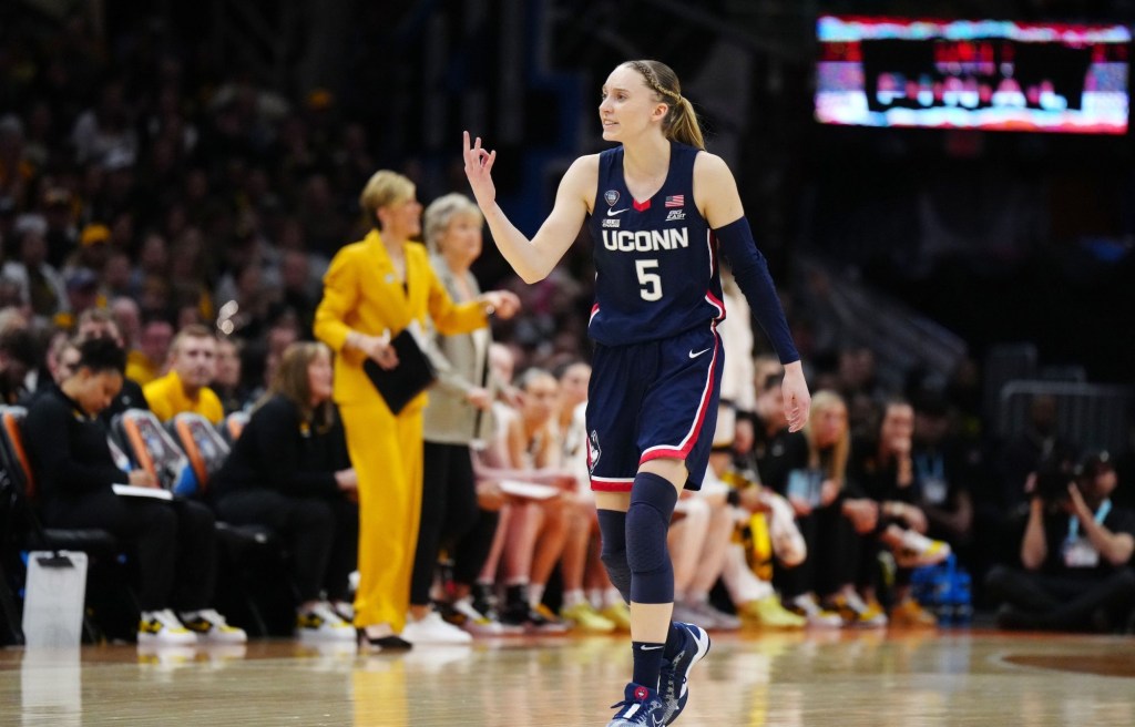 Apr 5, 2024; Cleveland, OH, USA; Connecticut Huskies guard Paige Bueckers (5) reacts in the second quarter against the Iowa Hawkeyes in the semifinals of the Final Four of the womens 2024 NCAA Tournament at Rocket Mortgage FieldHouse.