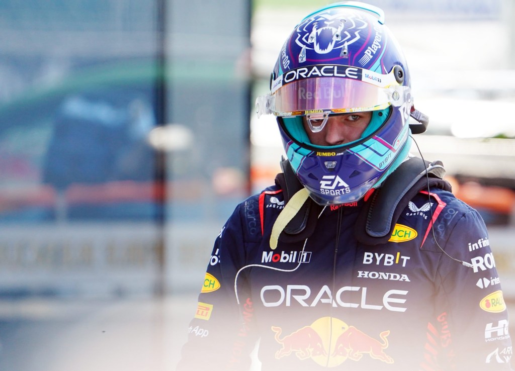 May 6, 2023; Miami Gardens, Florida, USA; Red Bull driver Max Verstappen (1) of the Netherlands walks through the garage area following qualifying for the Miami Grand Prix at Miami International Autodrome.