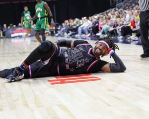 Jan 7, 2024; Des Moines, Iowa, USA; Harlem Globetrotters HAMMER HARRISON (31) interrupts the game for an impromptu photo shoot during their game with the Washington Generals at Wells Fargo Arena.