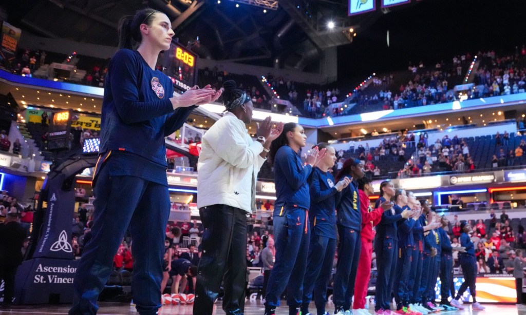 May 9, 2024; Indianapolis, IN, USA; Indiana Fever guard Caitlin Clark (22) stands with the team during the national anthem on Thursday, May 9, 2024, during the preseason game against the Atlanta Dream at Gainbridge Fieldhouse in Indianapolis.