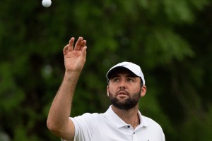 Scottie Scheffler catches a ball from his caddie during day three of practice for the PGA Championship at Valhalla Golf Club on Wednesday, May 15, 2024.