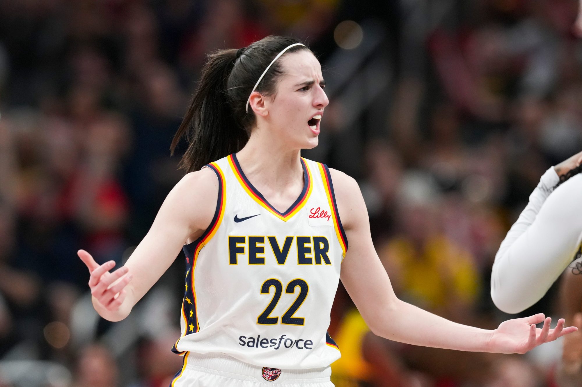 Indiana Fever guard Caitlin Clark (22) talks to Seattle Storm guard Victoria Vivians (35) following being run into after making a three-pointer, Thursday, May 30, 2024, during the WNBA game at Gainbridge Fieldhouse in Indianapolis.