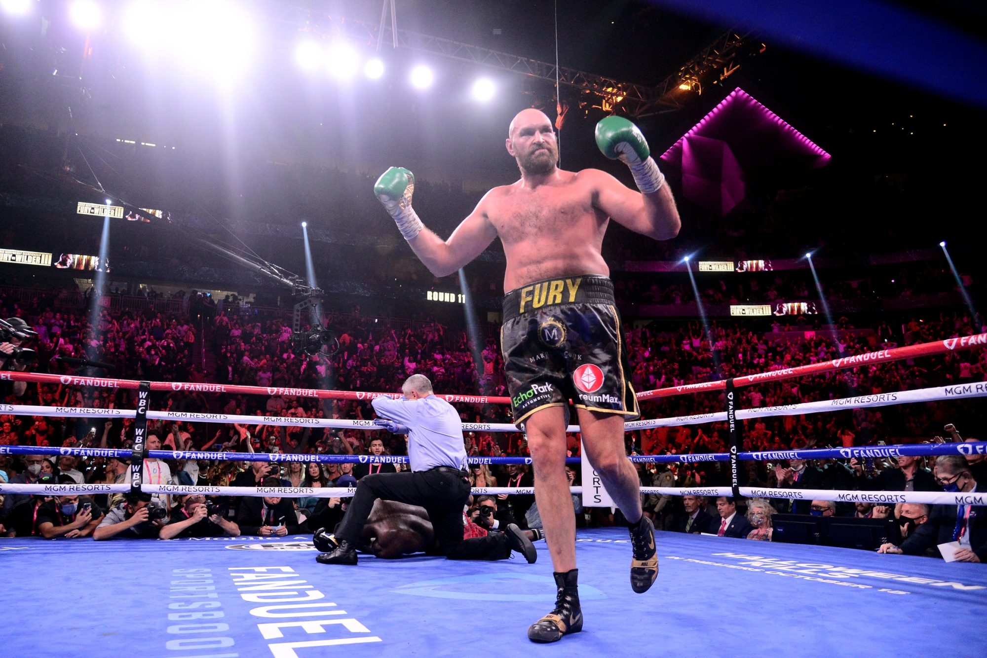 Oct 9, 2021; Las Vegas, Nevada, USA; Deontay Wilder (red/black trunks) is knocked out by Tyson Fury (black/gold trunks) during their WBC/Lineal heavyweight championship boxing match at T-Mobile Arena. Mandatory Credit: Joe Camporeale-USA TODAY Sports