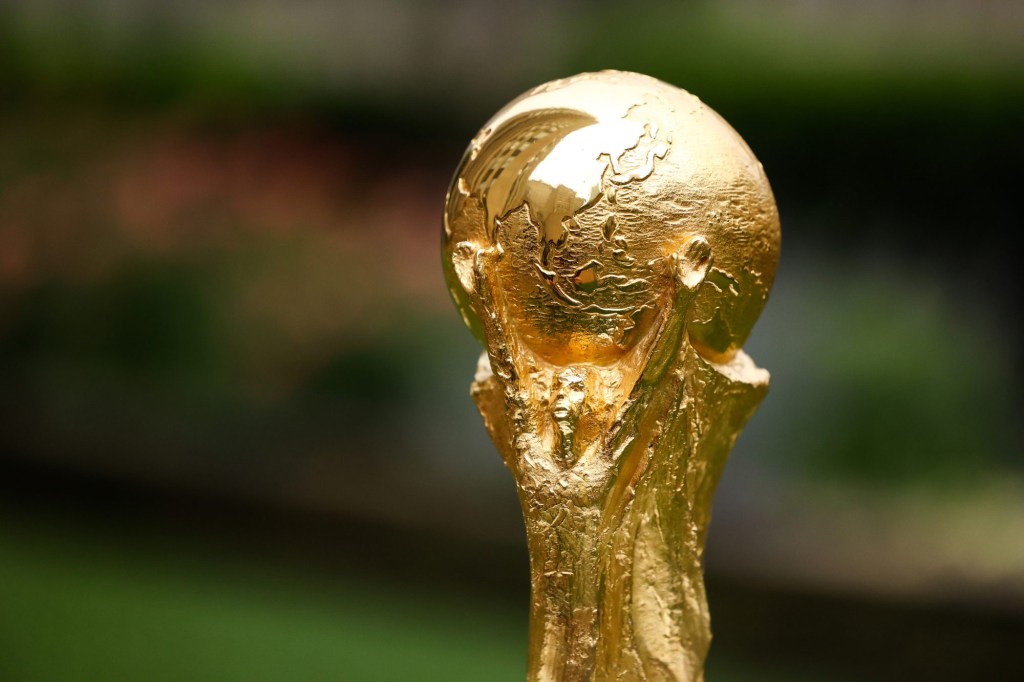 Jun 16, 2022; New York, New York, USA; A detail view of The FIFA World Cup Trophy sits on a stand outside of 30 Rockefeller Plaza.