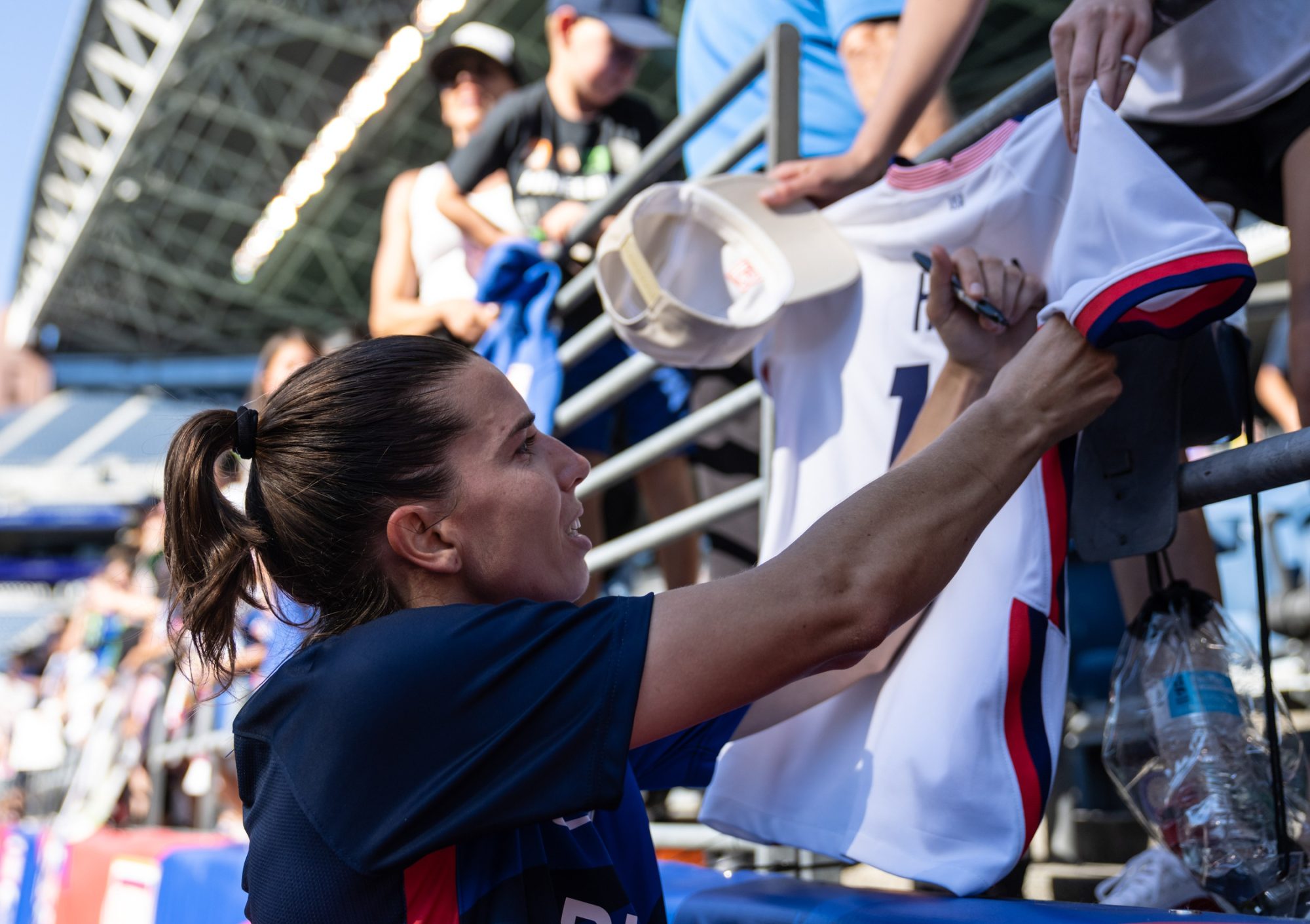 Aug 7, 2022; Seattle, Washington, USA; OL Reign midfielder Tobin Heath (77) signs autographs for fans after a match against the Houston Dash at Lumen Field.