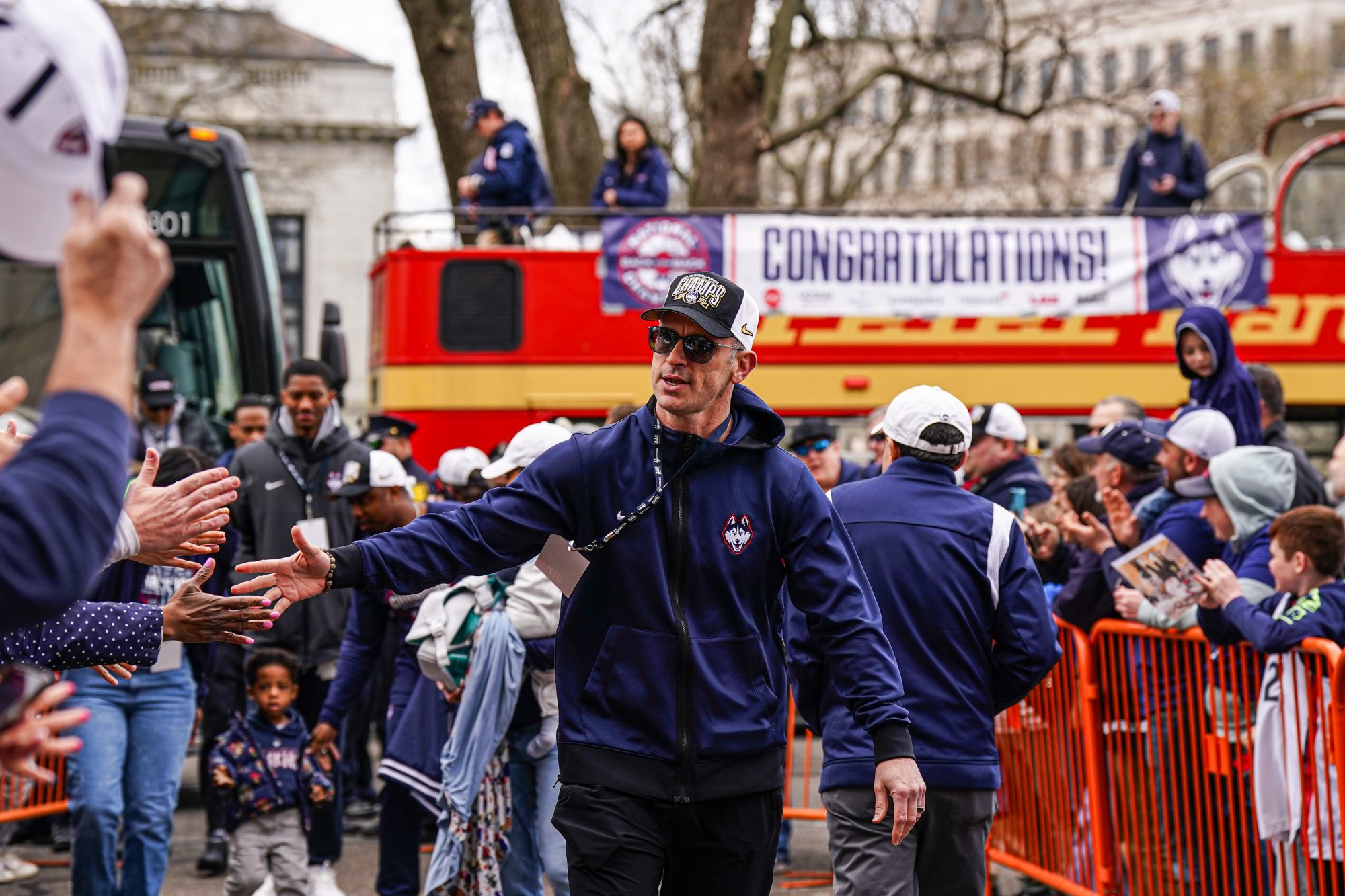 Apr 13, 2024; Hartford, CT, USA; UConn Huskies head coach Dan Hurley greets fans as he arrives at the state capitol before the teams victory parade.