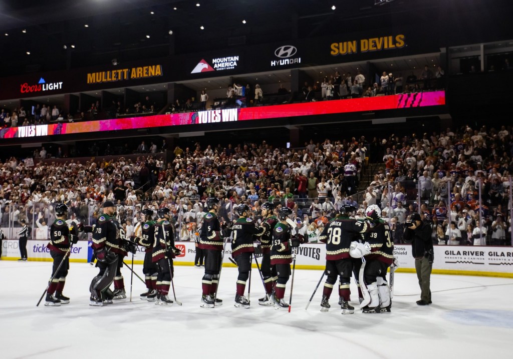 Apr 17, 2024; Tempe, Arizona, USA; Arizona Coyotes players celebrate together on the ice after defeating the Edmonton Oilers 5-2 at Mullett Arena.