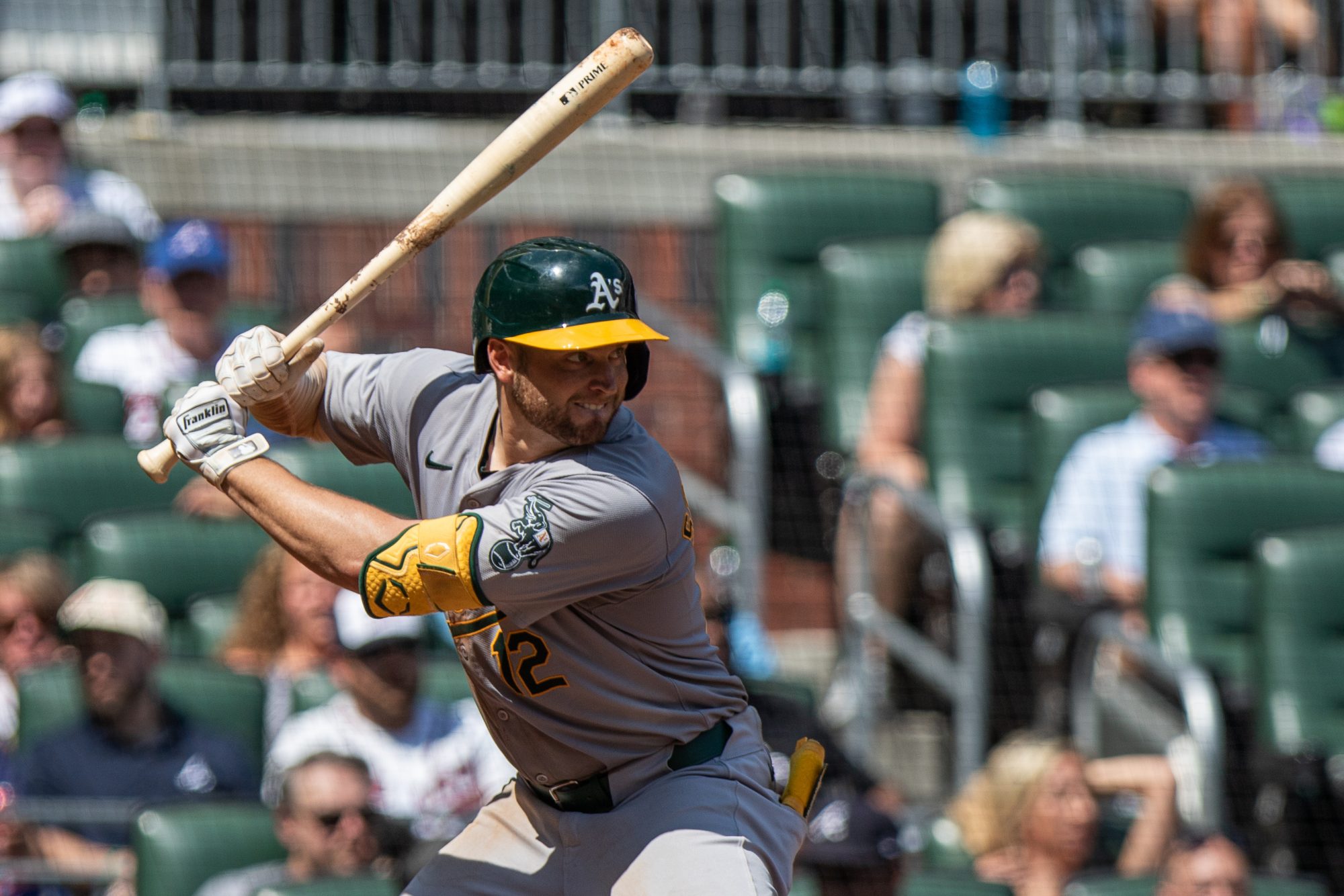 Jun 2, 2024; Cumberland, Georgia, USA; Oakland Athletics shortstop Max Schuemann (12) waits for the pitch from the Atlanta Braves during the eighth inning at Truist Park.