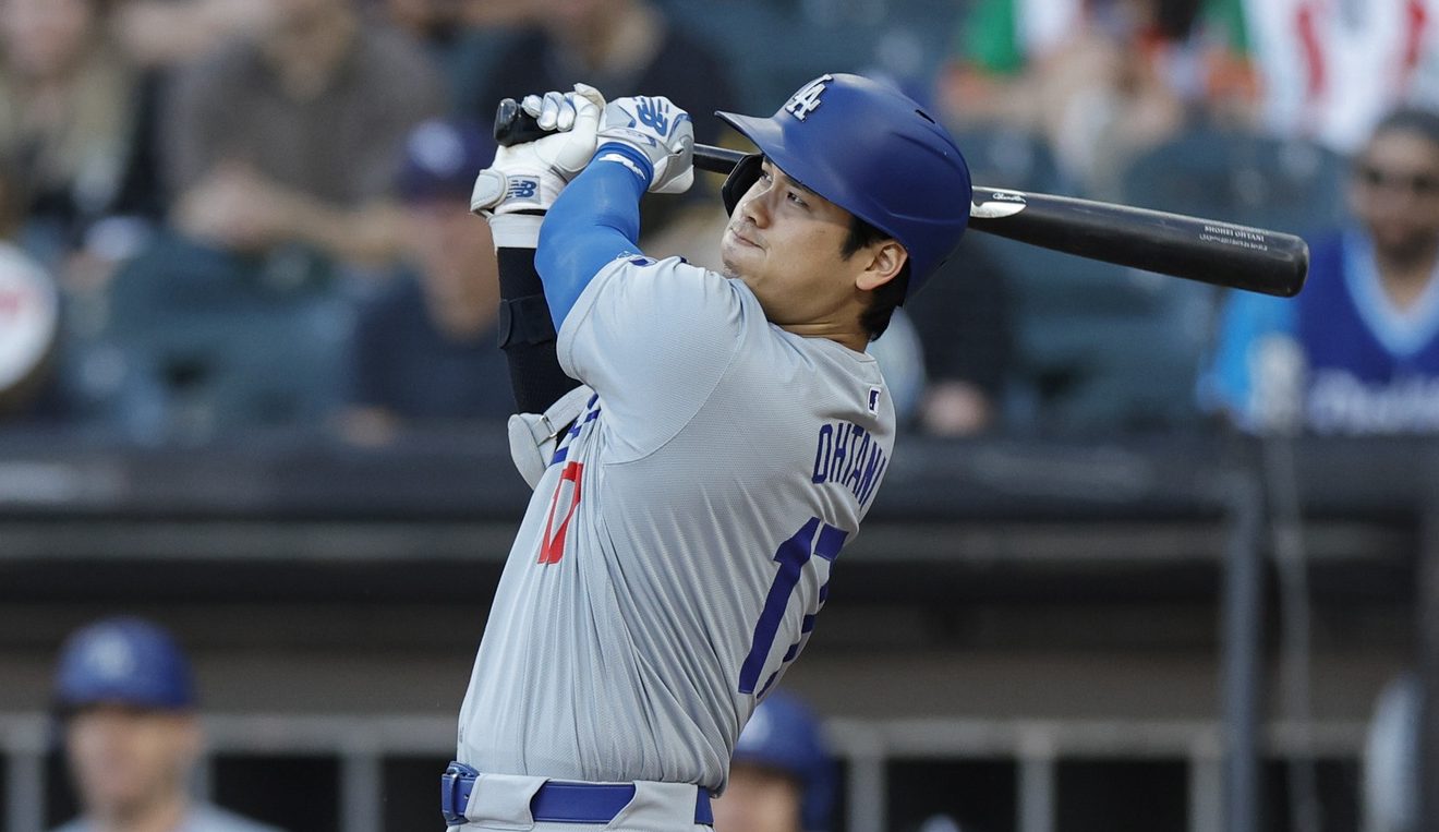 Jun 26, 2024; Chicago, Illinois, USA; Los Angeles Dodgers designated hitter Shohei Ohtani (17) hits a solo home run against the Chicago White Sox during the first inning at Guaranteed Rate Field.