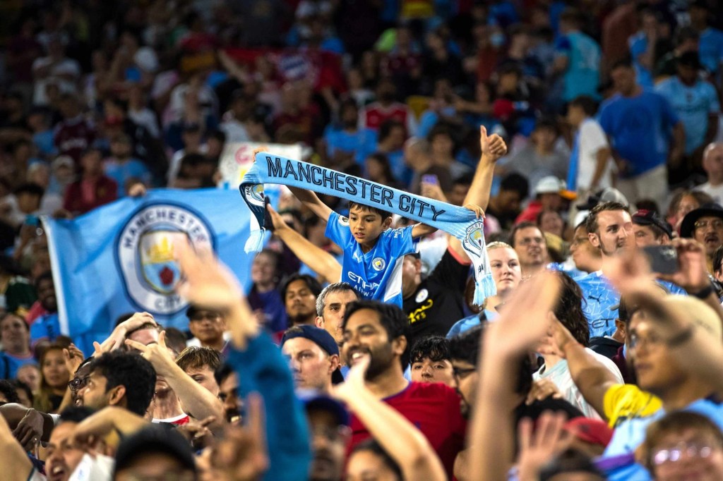 A young fan holds a \"Manchester City\" scarf after the exhibition match between FC Bayern Munich and Manchester City on Saturday, July 23, 2022, at Lambeau Field in Green Bay, Wis. Gpg Bayern Man City Match 7232022 0004