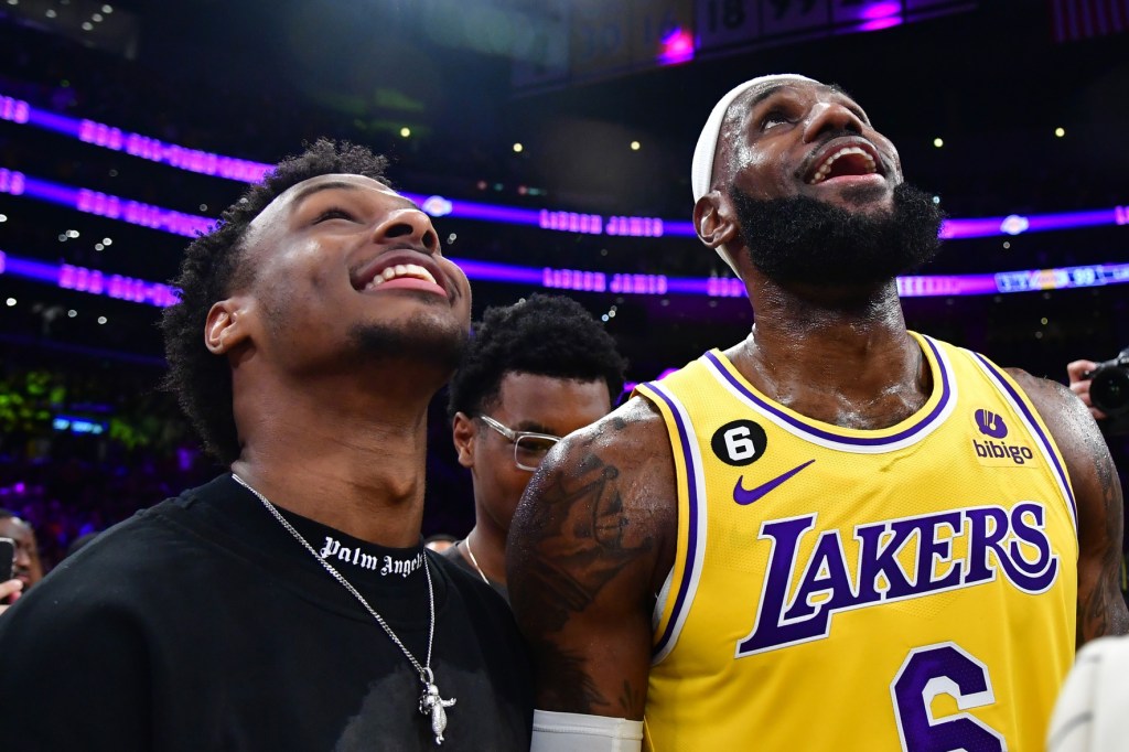 Feb 7, 2023; Los Angeles, California, USA; Los Angeles Lakers forward LeBron James (6) celebrates with his son Bronny James after breaking the all-time scoring record in the third quarter against the Oklahoma City Thunder at Crypto.com