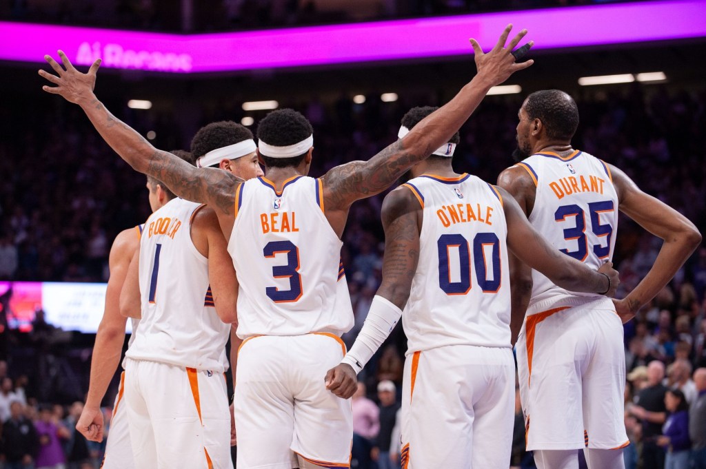 Apr 12, 2024; Sacramento, California, USA; Phoenix Suns guard Grayson Allen (8) and guard Devin Booker (1) and guard Bradley Beal (3) and forward Royce O'Neale (00) and forward Kevin Durant (35) huddle up before the final seconds of the fourth quarter at Golden 1 Center.