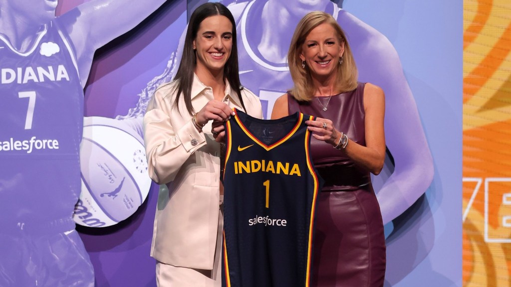 Apr 15, 2024; Brooklyn, NY, USA; Caitlin Clark poses with WNBA commissioner Cathy Engelbert after being selected with the number one overall pick to the Indiana Fever during the 2024 WNBA Draft at the Brooklyn Academy of Music.