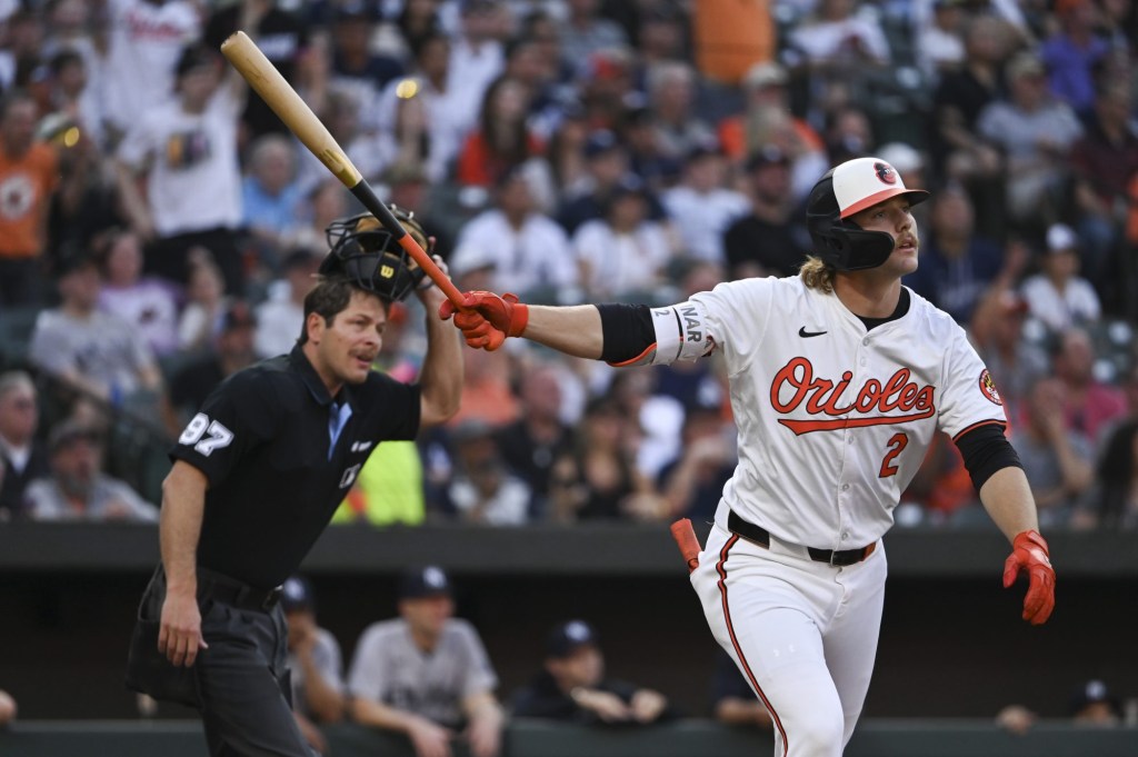 Apr 29, 2024; Baltimore, Maryland, USA; Baltimore Orioles shortstop Gunnar Henderson (2) swings through a first inning solo home run against the New York Yankees at Oriole Park at Camden Yards.