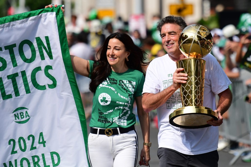 Jun 21, 2024; Boston, MA, USA; Boston Celtics majority owner Wyc Grousbeck holds the Larry OBrien trophy prior to the Boston Celtics championship parade.