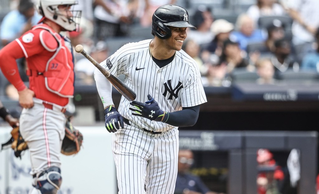 Jul 4, 2024; Bronx, New York, USA; New York Yankees right fielder Juan Soto (22) reacts after hitting a two run home run in the seventh inning against the Cincinnati Reds at Yankee Stadium.