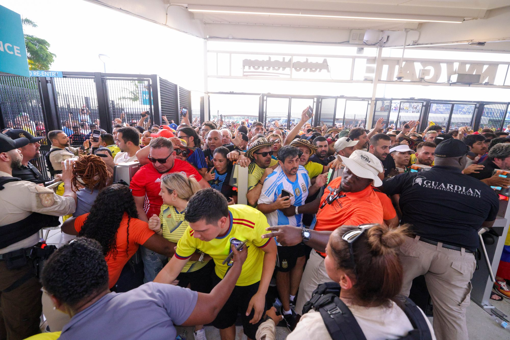 Jul 14, 2024; Miami, FL, USA; fans rush the gates before the Copa America Final match between Argentina and Colombia at Hard Rock Stadium.