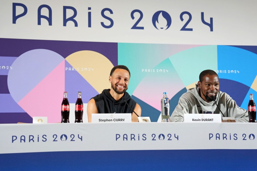 Jul 25, 2024; Paris, France; USA basketball players Stephen Curry and Kevin Durant talk to the media during a press conference. Mandatory Credit: 