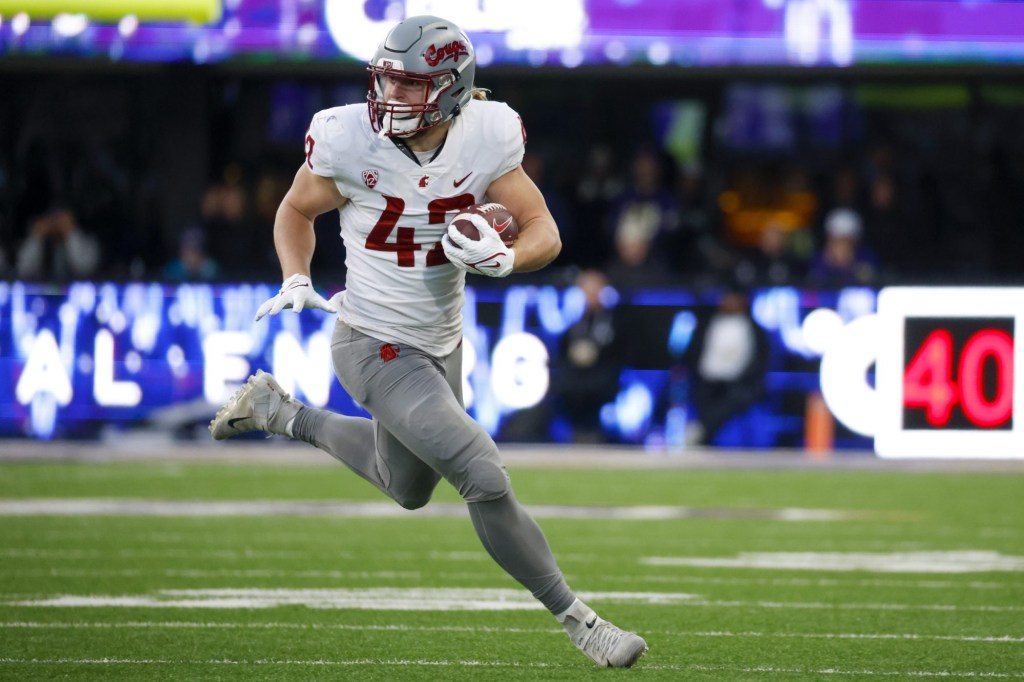 Nov 25, 2023; Seattle, Washington, USA; Washington State Cougars tight end Billy Riviere III (42) runs for yards after the catch against the Washington Huskies during the fourth quarter at Alaska Airlines Field at Husky Stadium