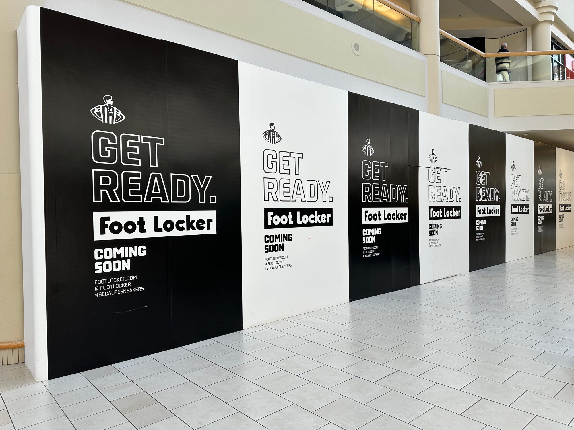 A construction barrier at Freehold Raceway Mall highlights a new Foot Locker store on the way.