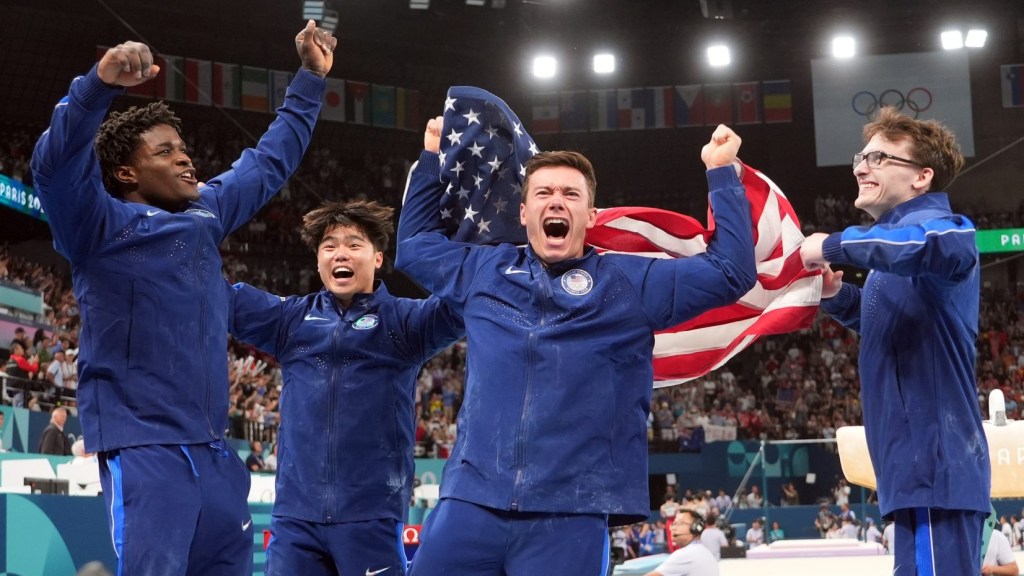 Jul 29, 2024; Paris, France; (from left to right) Frederick Richard, Asher Hong, Brody Malone, and Stephen Nedoroscik celebrate after winning bronze during the men’s team final during the Paris 2024 Olympic Summer Games at Bercy Arena