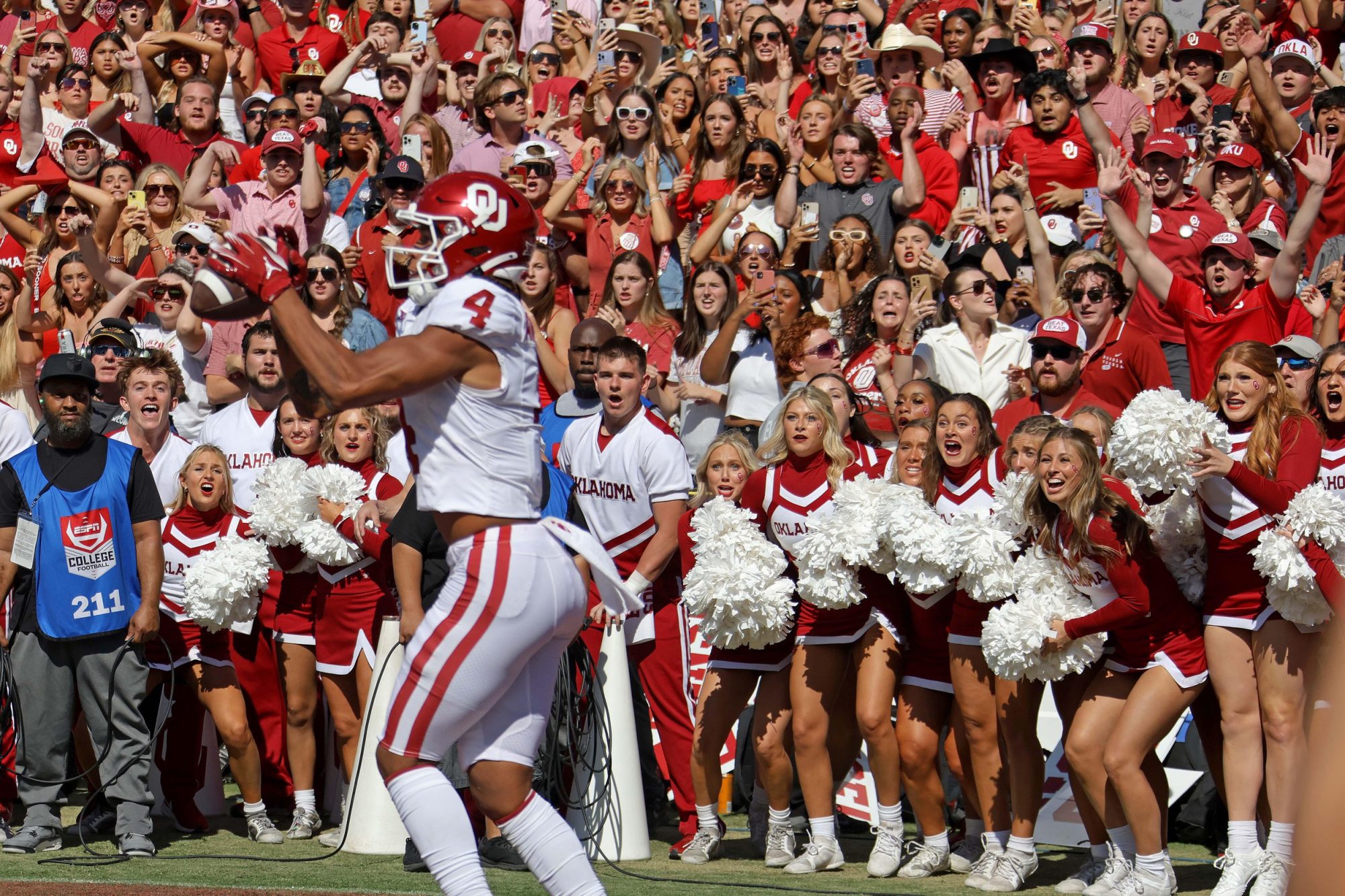 Oklahoma fans watch as Oklahoma Sooners wide receiver Nic Anderson (4) catches a touchdown pass in the final seconds of the Red River Rivalry college football game between the University of Oklahoma Sooners (OU) and the University of Texas (UT) Longhorns at the Cotton Bowl in Dallas, Saturday, Oct. 7, 2023. Oklahoma won 34-30.