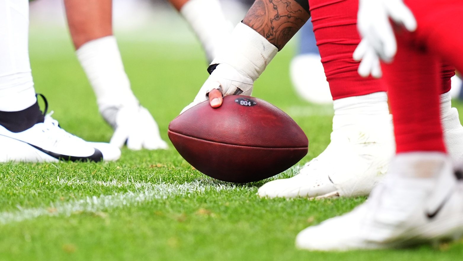 Aug 25, 2024; Denver, Colorado, USA; Detailed view of a Denver Broncos snapping the football in the second half against the Arizona Cardinals at Empower Field at Mile High.