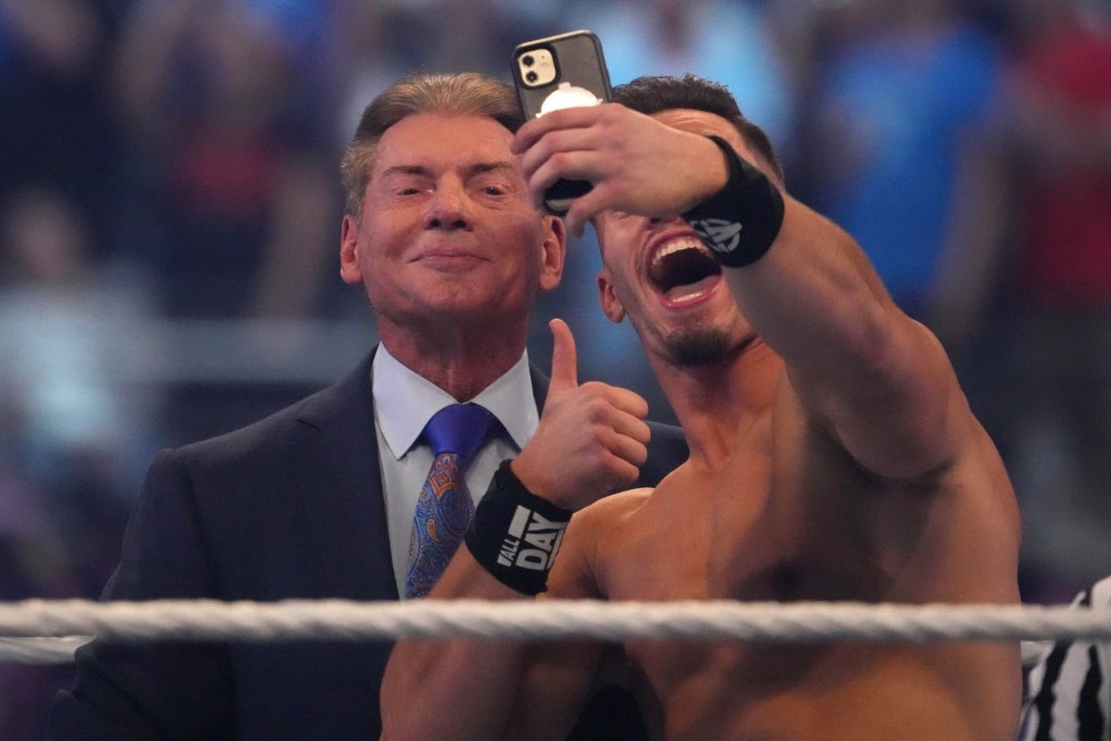 Austin Theory takes a selfie with WWE owner Vince McMahon during WrestleMania at AT&T Stadium.