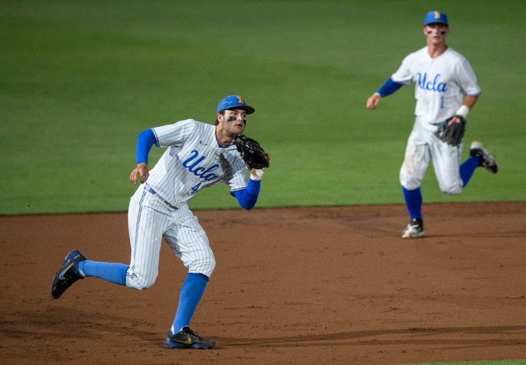 UCLA Bruins infielder Kyle Karros (44) grabs a bouncing ground ball as Auburn Tigers take on UCLA Bruins during the NCAA regional baseball tournament at Plainsman Park in Auburn, Ala., on Sunday, June 5, 2022.