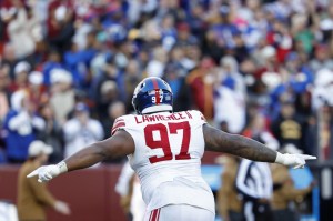 New York Giants defensive tackle Dexter Lawrence II (97) celebrates after an interception against the Washington Commanders during the fourth quarter at FedExField.