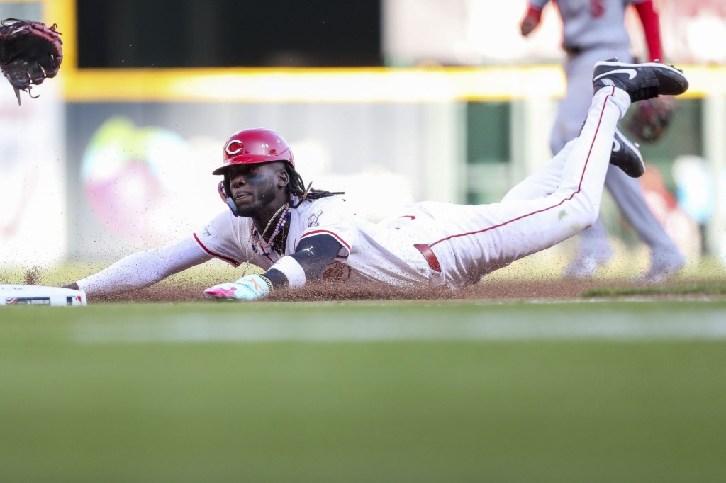 Mar 28, 2024; Cincinnati, Ohio, USA; Cincinnati Reds shortstop Elly De La Cruz (44) steals third base in the eighth inning against the Washington Nationals at Great American Ball Park. 