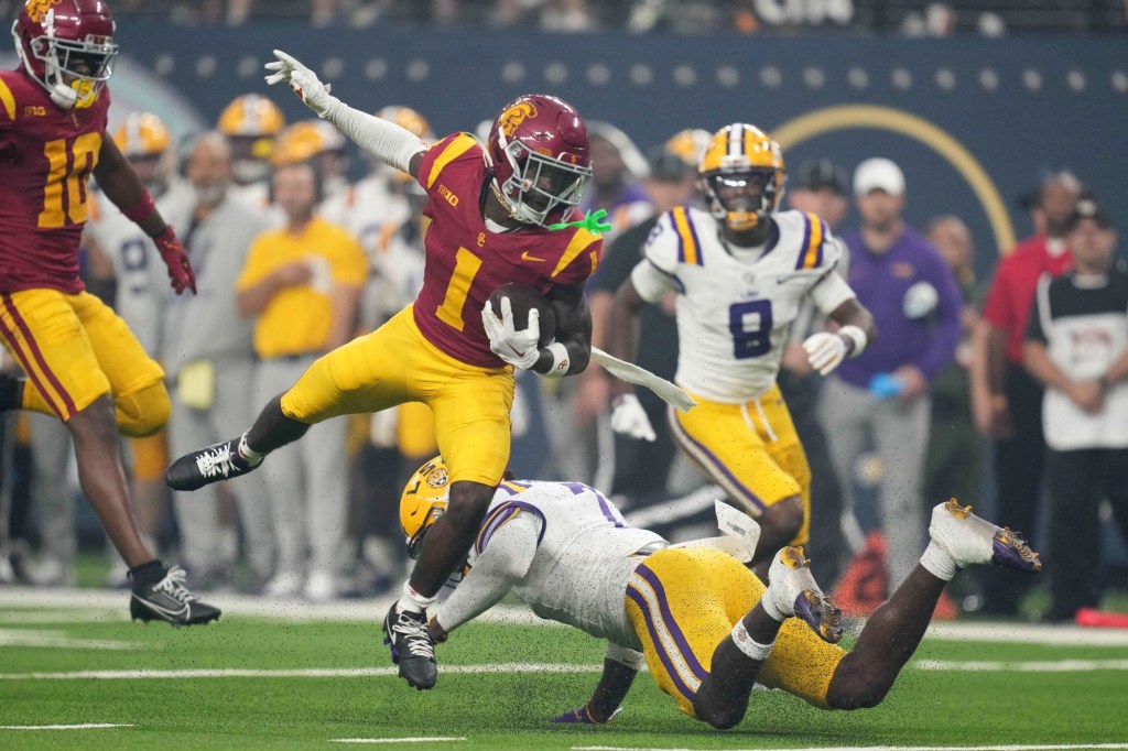 Sep 1, 2024; Paradise, Nevada, USA; Southern California Trojans wide receiver Zachariah Branch (1) carries the ball against LSU Tigers linebacker Harold Perkins Jr. (7) in the first half at Allegiant Stadium.