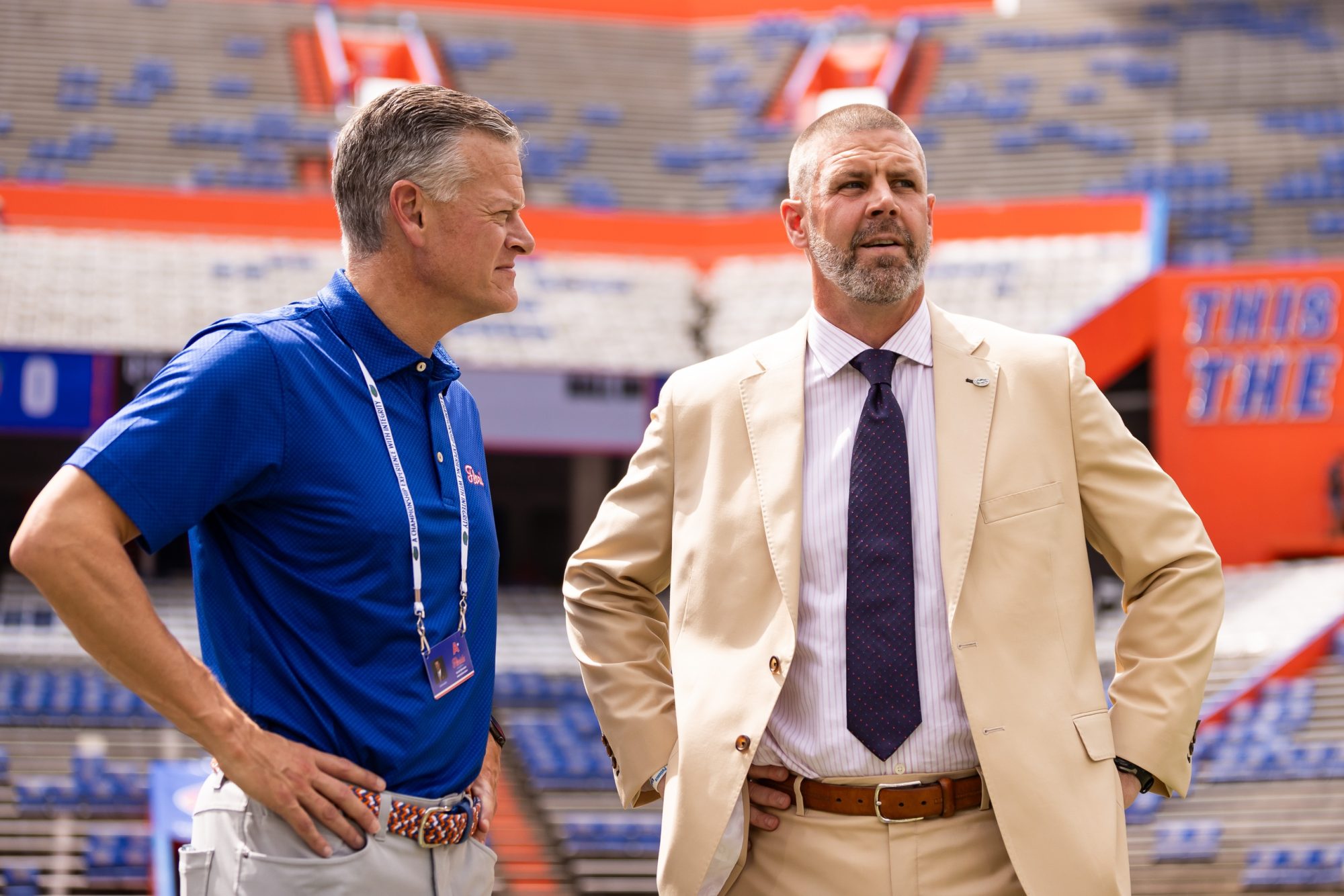 Gainesville, Florida, USA; Florida Gators athletic director Scott Stricklin (left) and head coach Billy Napier talk before a game against the Texas A&M Aggies at Ben Hill Griffin Stadium.