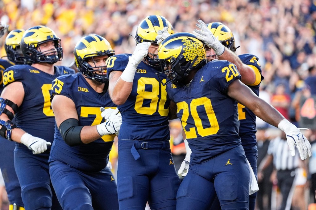 Running back Kalel Mullings (20) celebrates a touchdown against USC with teammates during the second half at Michigan Stadium in Ann Arbor on Saturday, Sept. 21, 2024.