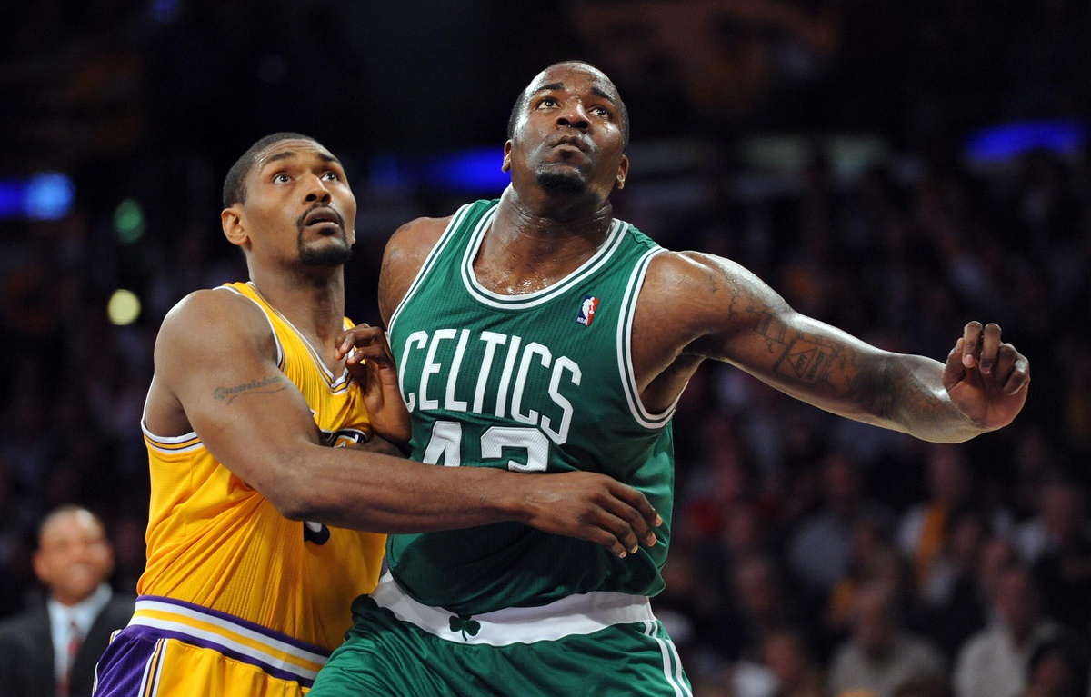 Boston Celtics center Kendrick Perkins (43) and Los Angeles Lakers forward Ron Artest (15) fight for position under the basket during the 4th quarter of the game at the Staples Center.