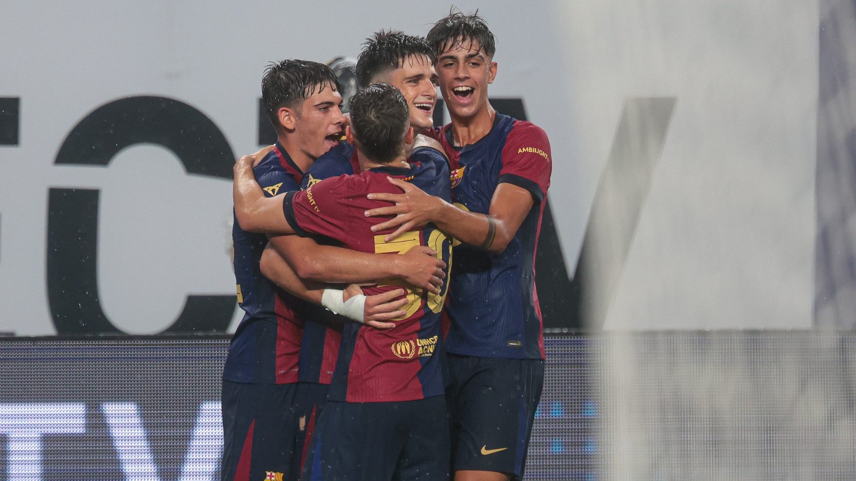 Aug 3, 2024; East Rutherford, NJ, USA; Barcelona midfielder Pau Victor (8) celebrates his goal with teammates during the second half of an international friendly against Real Madrid at MetLife Stadium. V