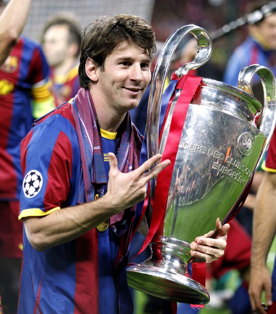 May 28, 2011; London, ENGLAND; FC Barcelona player Lionel Messi celebrates with the trophy after defeating Manchester United 3-1 in the 2011 UEFA Champions League final at Wembley Stadium. 