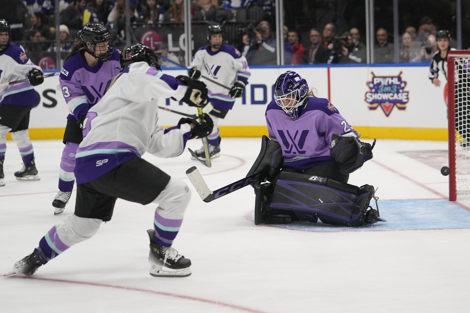 Feb 1, 2024; Toronto, Ontario, CANADA; Team King defender Savannah Harmon (15) scores against Team Kloss goaltender Nicole Hensley (29) during the PWHL 3-on-3 Showcase during NHL All-Star Thursday at Scotiabank Arena.