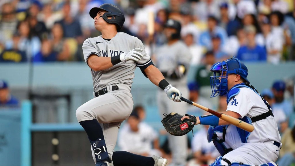 Jun 4, 2023; Los Angeles, California, USA; New York Yankees shortstop Anthony Volpe (11) hits a two run home run against the Los Angeles Dodgers during the ninth inning at Dodger Stadium.