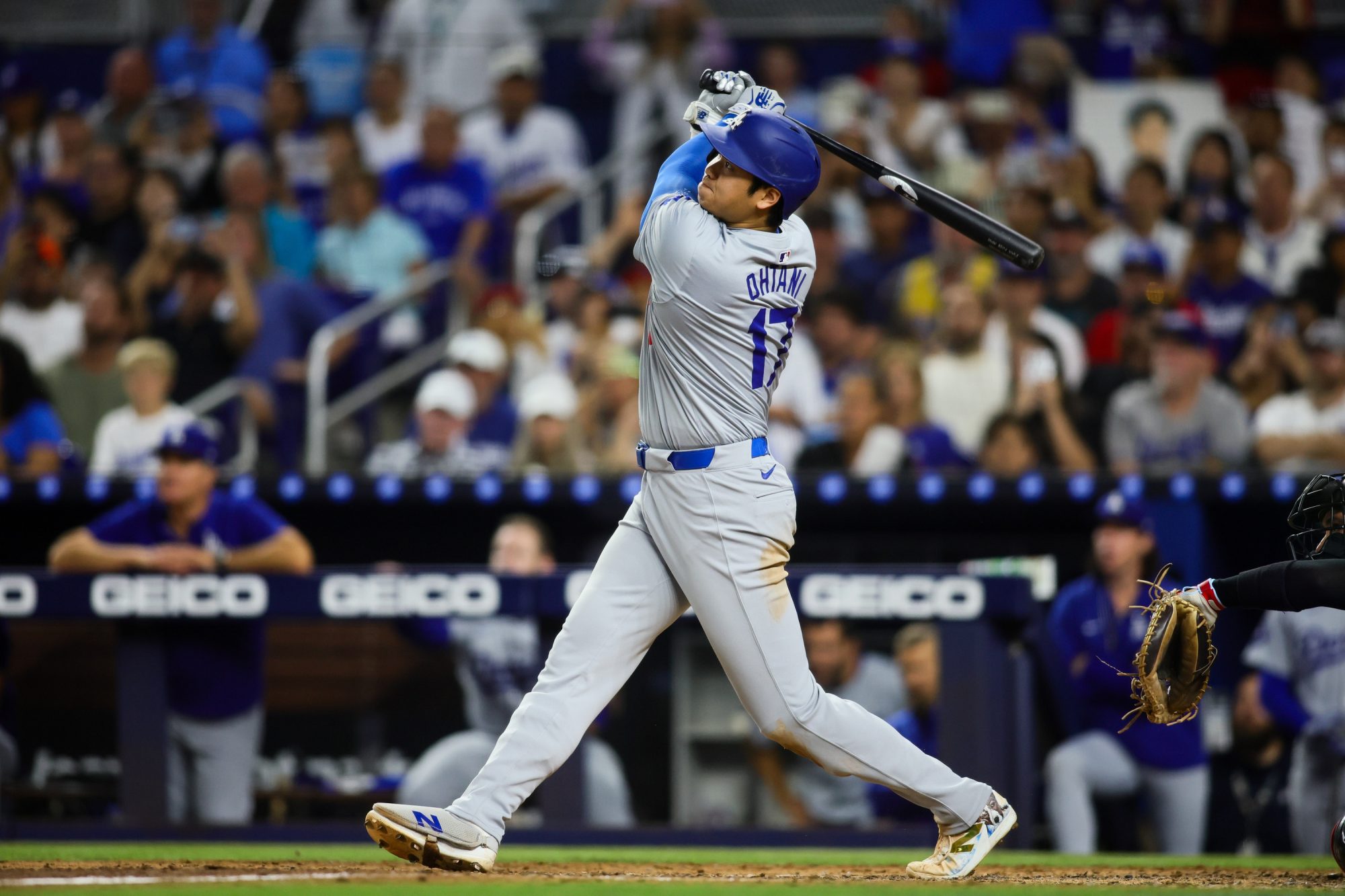 Sep 19, 2024; Miami, Florida, USA; Los Angeles Dodgers designated hitter Shohei Ohtani (17) hits a two-run home run against the Miami Marlins during the sixth inning at loanDepot Park.