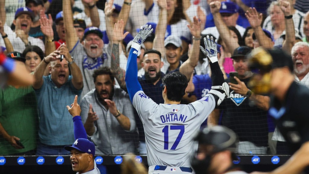 Sep 19, 2024; Miami, Florida, USA; Los Angeles Dodgers designated hitter Shohei Ohtani (17) reacts to a standing ovation from the fans after hitting his 50th home run of the season against the Miami Marlins during the seventh inning at loanDepot Park.