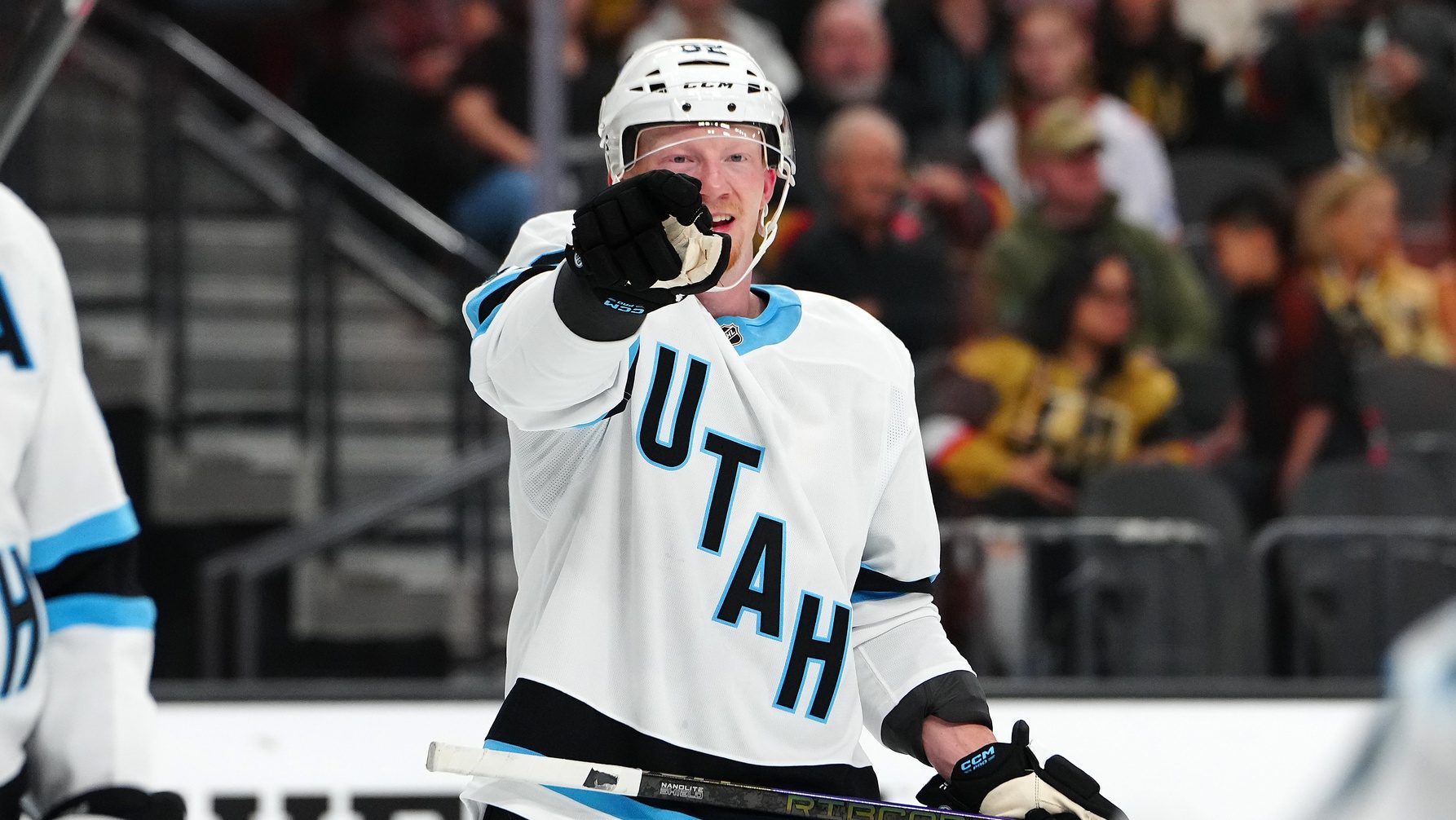 Sep 27, 2024; Las Vegas, Nevada, USA; Utah Hockey Club forward Ben McCartney (62) directs a team mate before a face off against the Vegas Golden Knights during the second period at T-Mobile Arena