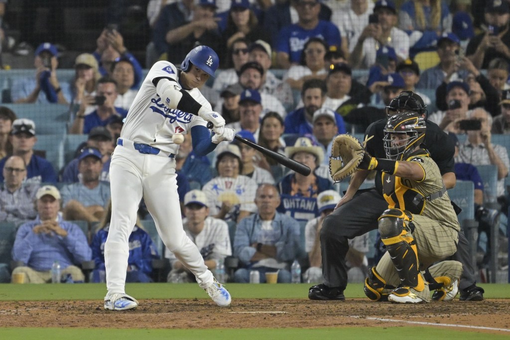 Oct 5, 2024; Los Angeles, California, USA; Los Angeles Dodgers designated hitter Shohei Ohtani (17) swings in the eighth inning against the San Diego Padres during game one of the NLDS for the 2024 MLB Playoffs at Dodger Stadium.