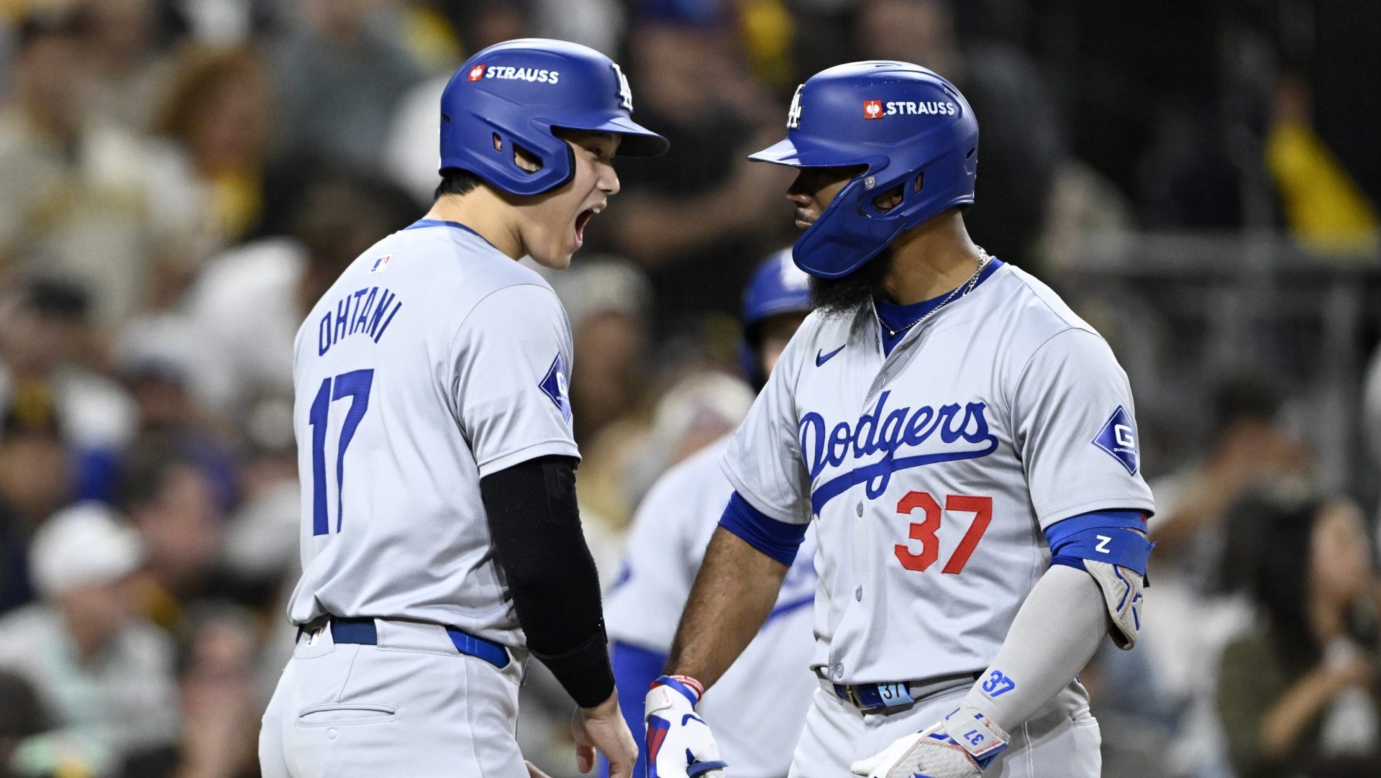 Oct 8, 2024; San Diego, California, USA; Los Angeles Dodgers outfielder Teoscar Hernandez (37) celebrates with designated hitter Shohei Ohtani (17) after hitting a grand slam in the third inning against the San Diego Padres during game three of the NLDS for the 2024 MLB Playoffs at Petco Park.