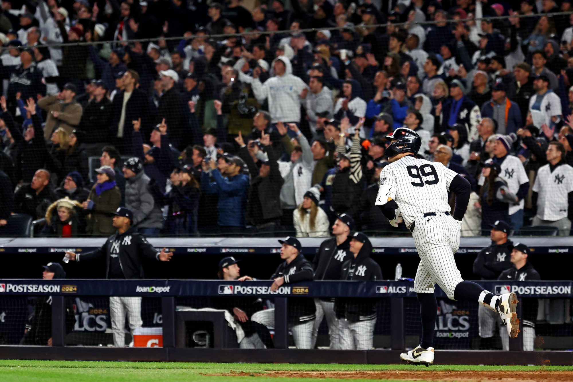 Oct 15, 2024; Bronx, New York, USA; New York Yankees outfielder Aaron Judge (99) hits a two run home run during the seventh inning against the Cleveland Guardians in game two of the ALCS for the 2024 MLB Playoffs at Yankee Stadium.