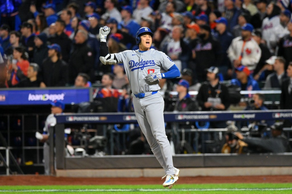 Oct 17, 2024; New York City, New York, USA; Los Angeles Dodgers two-way player Shohei Ohtani (17) reacts after hitting a solo home run against the New York Mets in the first inning during game four of the NLCS for the 2024 MLB playoffs at Citi Field.