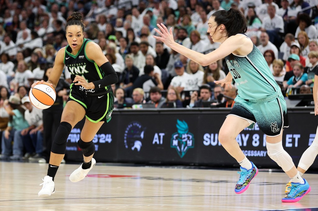 Oct 18, 2024; Minneapolis, Minnesota, USA; Minnesota Lynx forward Napheesa Collier (24) works around New York Liberty forward Breanna Stewart (30) during the first half of game four of the 2024 WNBA Finals at Target Center.